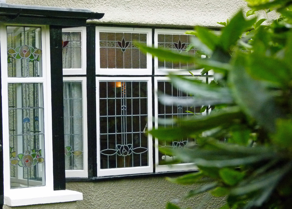 Leaded windows, stained glass - cosy and just a little bit posh. Lennon, middle-class, Mendips, Menlove Avenue