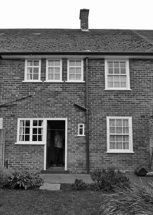 20 Forthlin Road from the rear in 2015. Compare it to the earlier photo below, with George, John and Paul. By all accounts, Paul also used to shin up that drainpipe - impressive - he was pretty good on bass too. I thought this looked better in black and white. McCartney, bathroom window Forthlin Road
